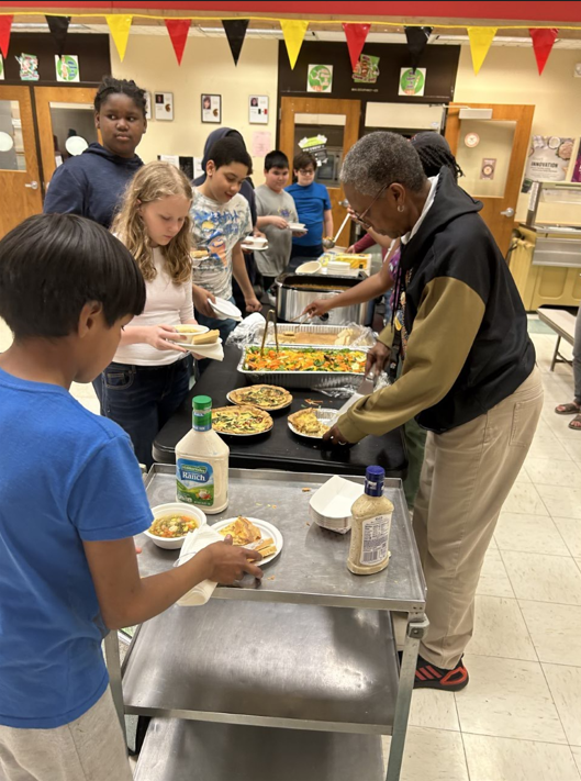 students go through buffet line to try traditional "Three Sister's Soup" catered by Native Chef, and quiches made with locally sourced ingredients catered by The Merc.